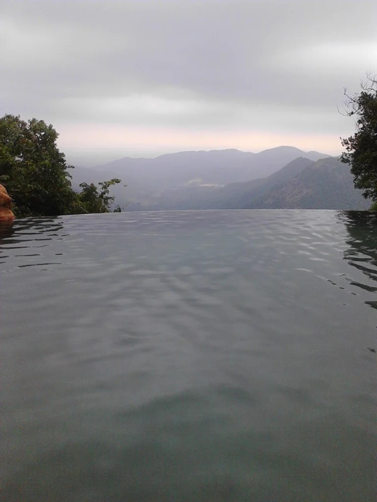 Swimming pool overlooking mountains (illustrative image)